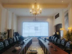 A conference room with a large LCD Video Wall screen displayed for presentations and meetings, Installed By EziSol.