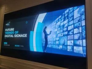 A 3x2 tiled LCD Video Wall display showing various images of beaches and greenery. Complete setup by EziSol