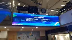 wall mounted SMD screen hanging on the wall, showing blue screen at NASTP, Karachi, Complete Solution Provided by EziSol
