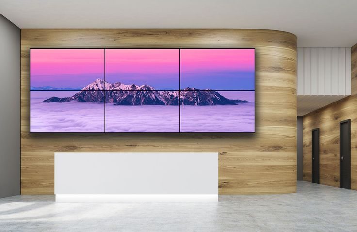 A 2x3 video wall installed on a wooden color wall.