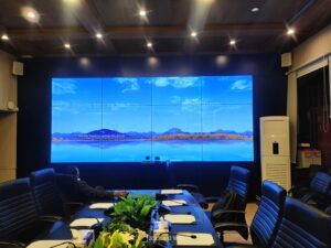 A conference room with a large LCD Video Wall screen displayed for presentations and meetings, Installed By EziSol.
