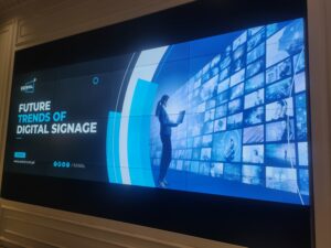 A 3x2 tiled LCD Video Wall display showing various images of beaches and greenery. Complete setup by EziSol