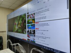 A 3x2 tiled LCD Video Wall display showing various images of beaches and greenery. Complete setup by EziSol