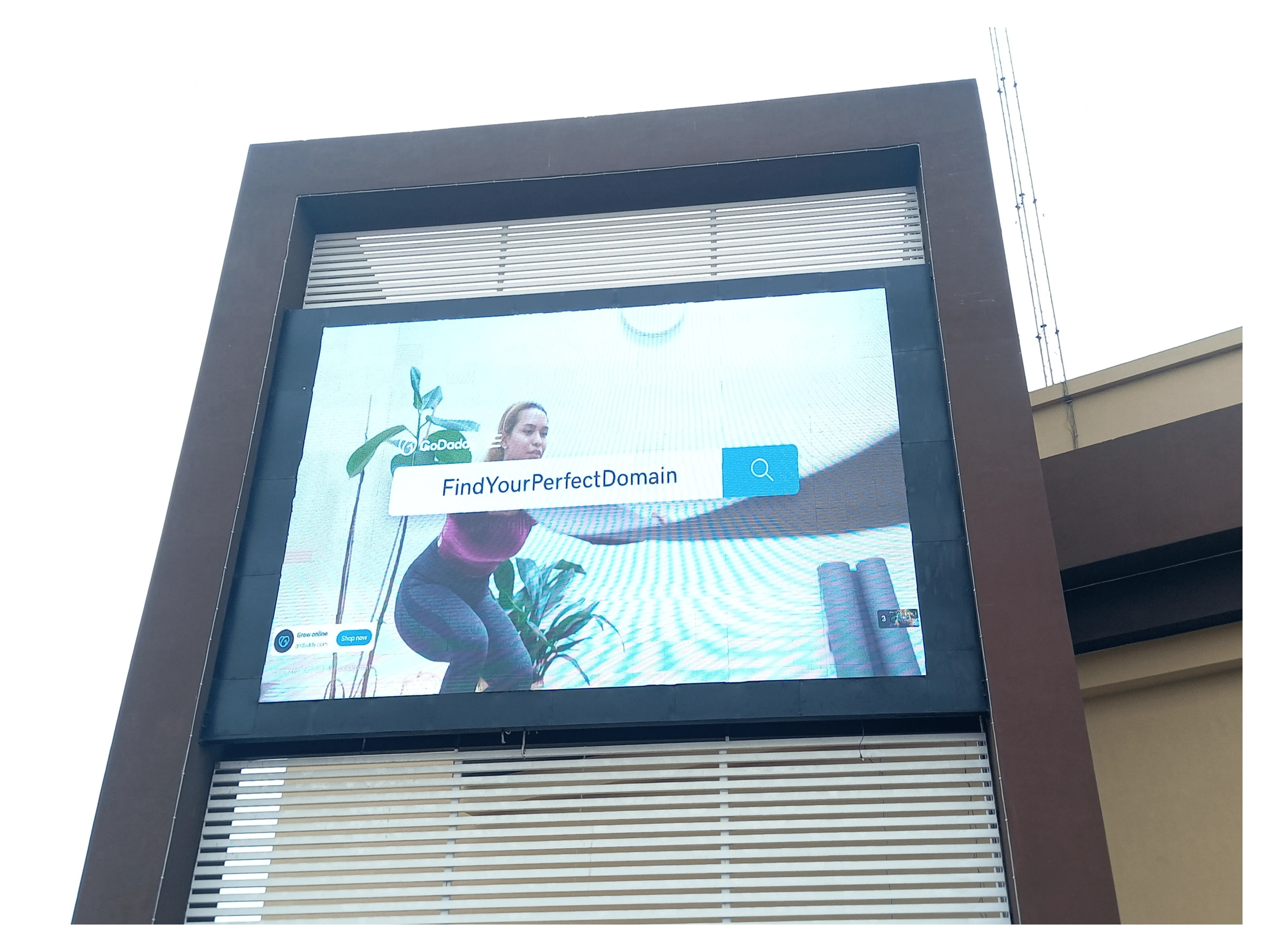 EziSol Installed a complete solution for P8 outdoor SMD Screen Showing a women doing exercise.