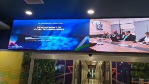 A large wall mounted curved SMD Screens showing dual display at NASTP at Karachi, Curved Screen Installed By EziSol